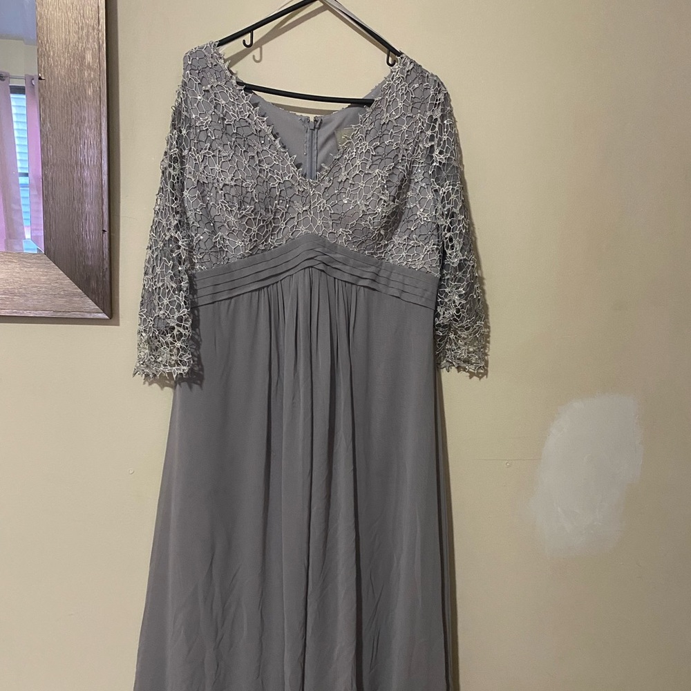 Almost new beautiful gray ball gown. Worn once for 2 hours. Size XL